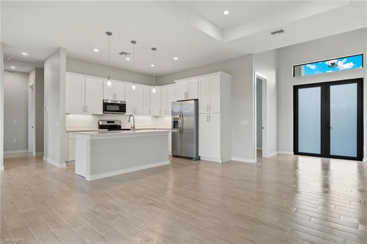 Flooring upgraded to premium, color-matched Luxury Vinyl Plank [LVP].