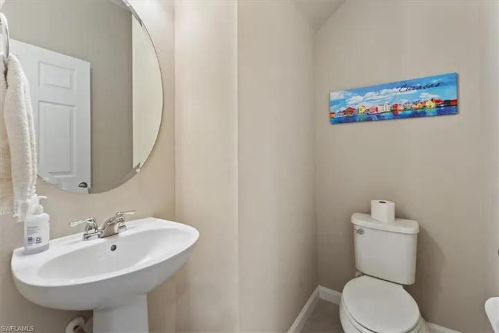 Bathroom featuring sink and toilet