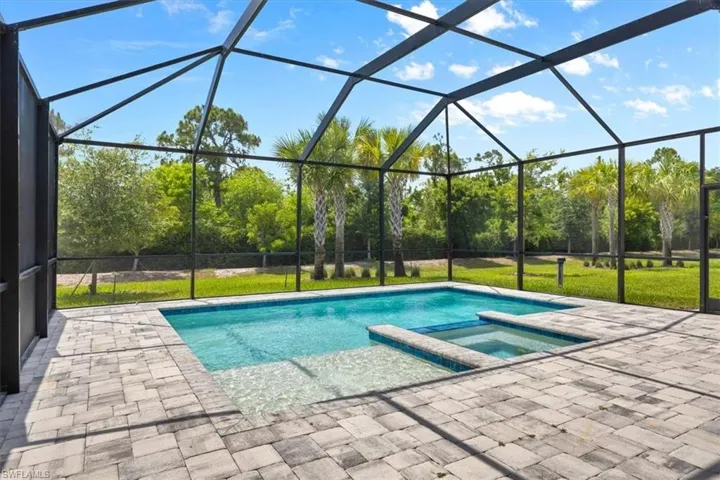 View of pool featuring a lanai and a patio