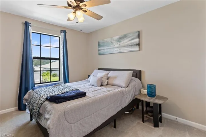 Bedroom with carpet flooring and ceiling fan