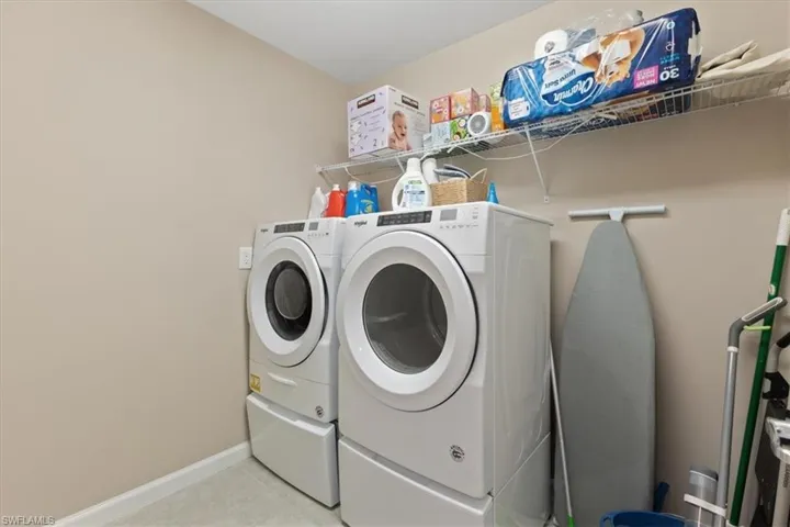 Washroom featuring independent washer and dryer