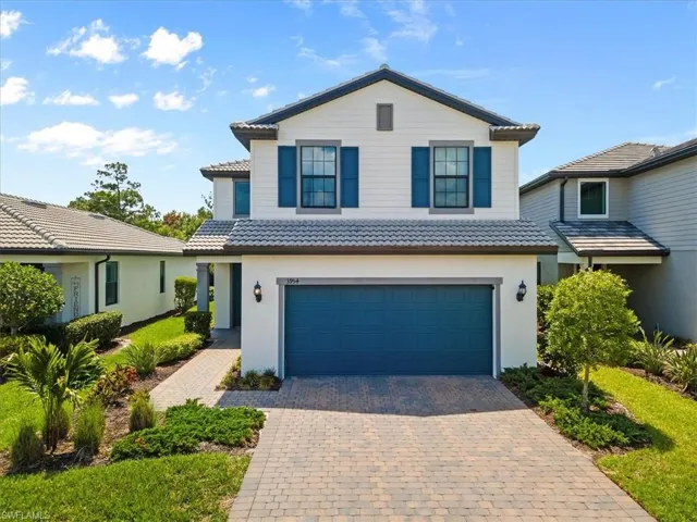 View of property featuring a garage