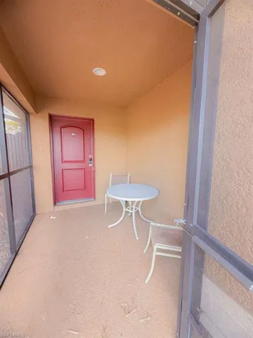View of exterior entry featuring stucco siding