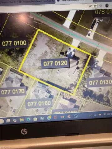 Aerial view of property's location featuring property parcel outlined