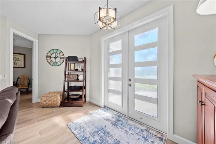 Doorway featuring light wood-type flooring and french doors