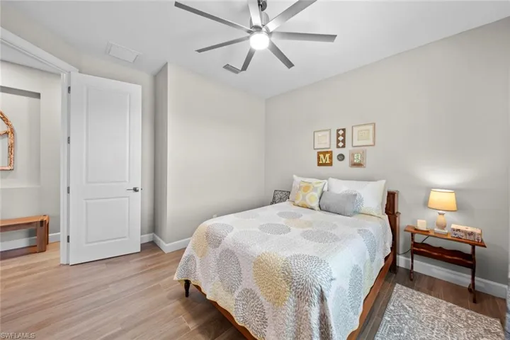 Bedroom with wood-type flooring and ceiling fan