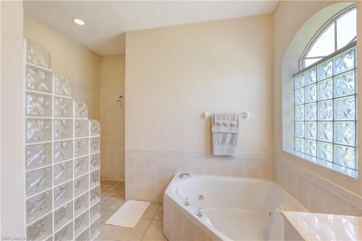 Master bathroom with separate garden tub and large walk in shower