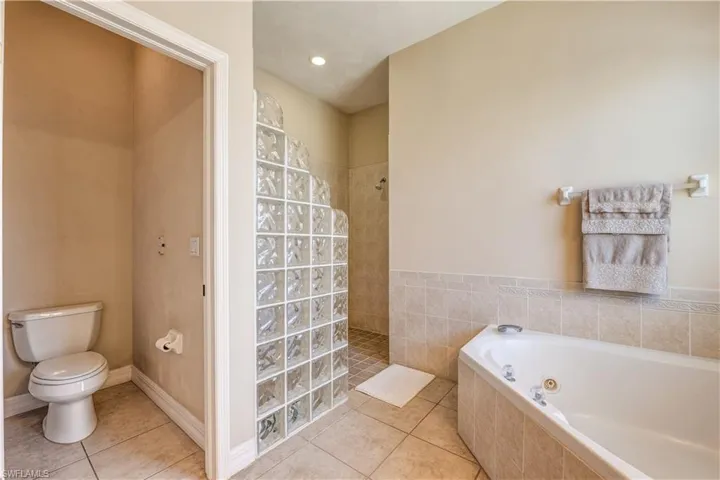 Master bathroom with private toilet closet