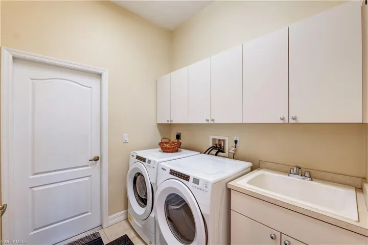 Inside laundry room with utility sink