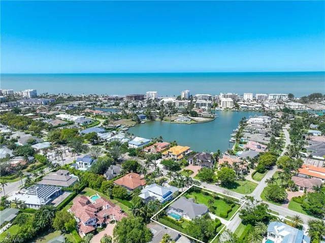 Drone / aerial view with a water view and a residential view