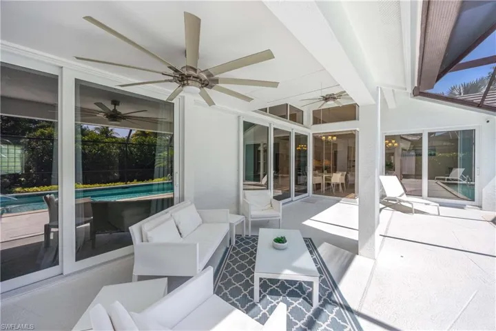 View of patio / terrace with an outdoor pool, a ceiling fan, and an outdoor living space