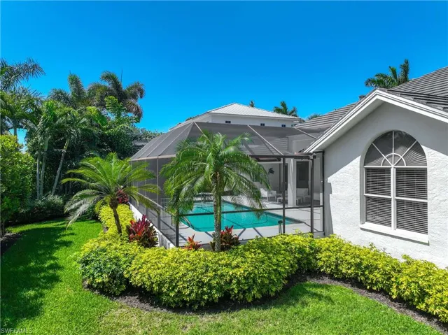 Pool with a patio and a yard