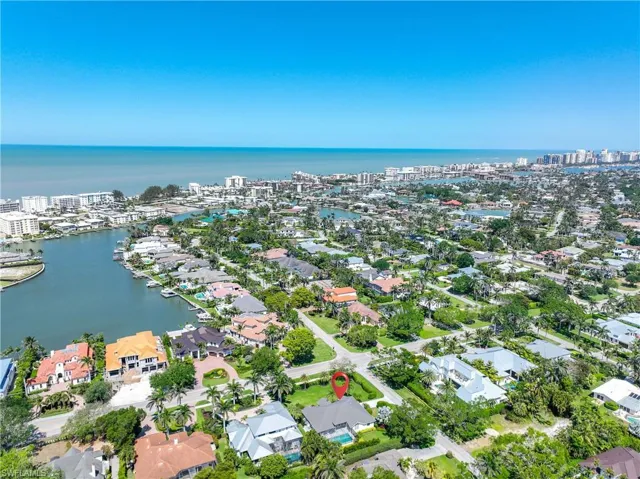 Aerial view featuring a view of city, a water view, and a residential view