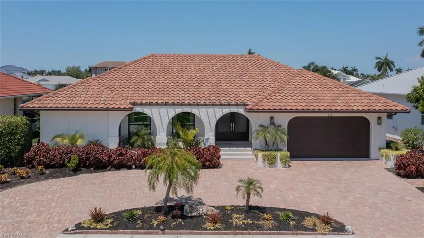 Mediterranean / spanish house featuring a porch