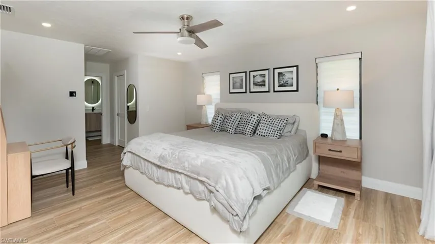 Bedroom with light hardwood / wood-style flooring and ceiling fan