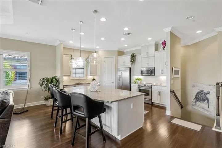 Please note the stainless steel appliances, abundance of cabinet space, and plantation shutters.