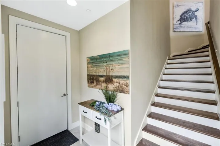 Entrance to garage and interior stairs that leads to the unit.