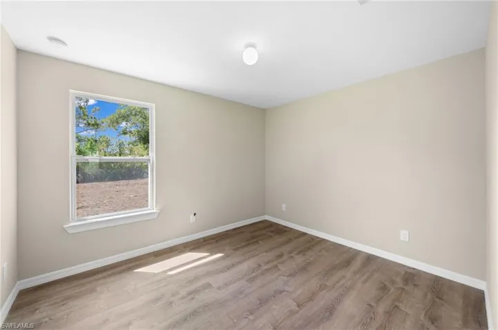 Unfurnished room with light hardwood / wood-style flooring