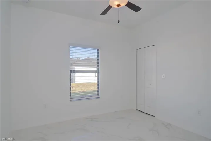 Unfurnished room with ceiling fan