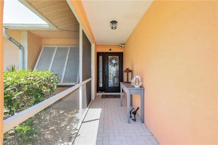 Lovely entryway showing the decorative easy to use shutters