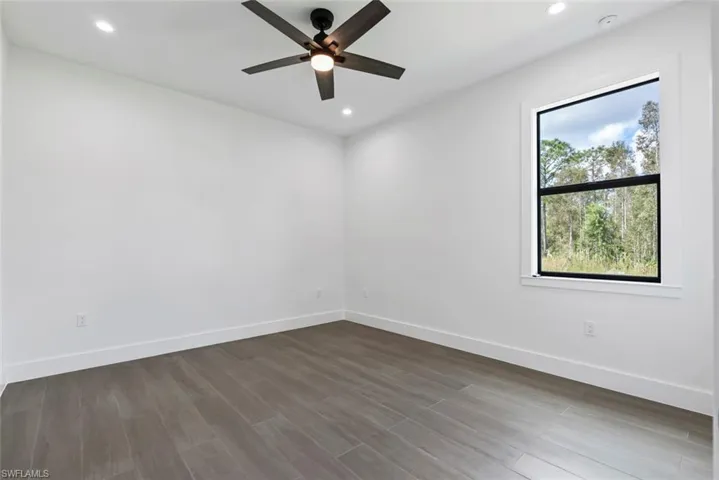 Guest room with tile floors and ceiling fan