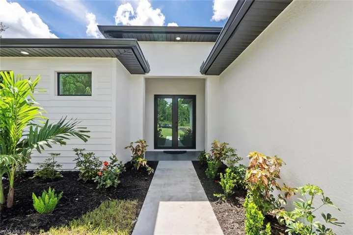 Entrance to property featuring french doors