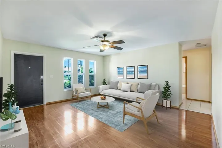 VIRTUAL STAGING Living room with baseboards, a ceiling fan, visible vents, and light wood-style floors