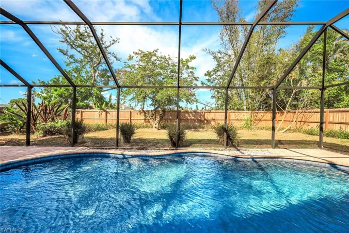 View of pool featuring a fenced in pool, a lanai, and a fenced backyard