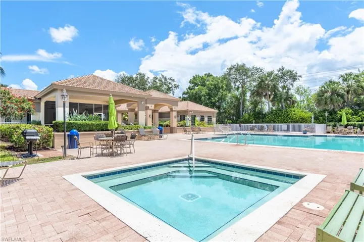 View of Commnunity Pool with a hot tub