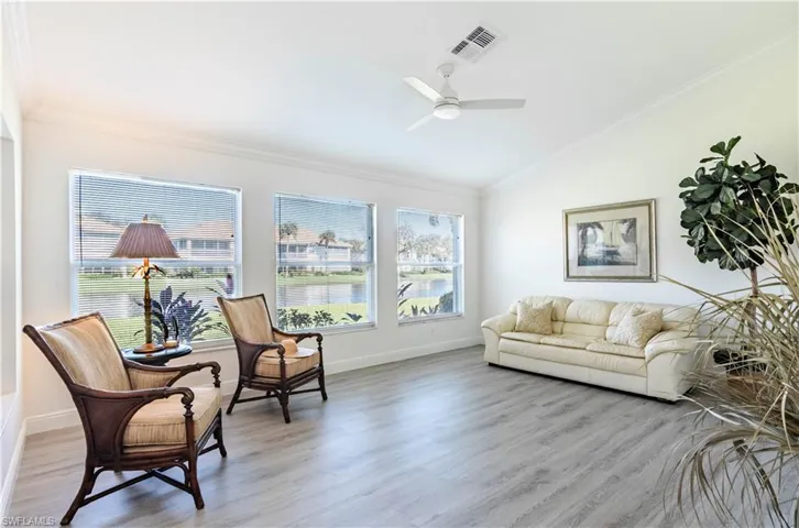 Living room with vaulted ceiling and commercial grade luxury vinyl flooring