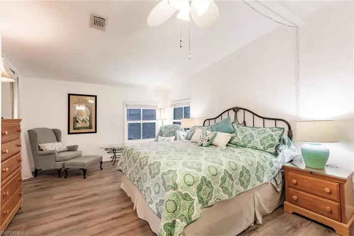 Bedroom featuring  ceiling fan, and laminate flooring
