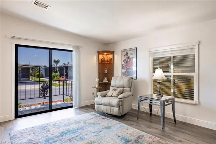 Living Room leads outdoors through solar tinted sliders