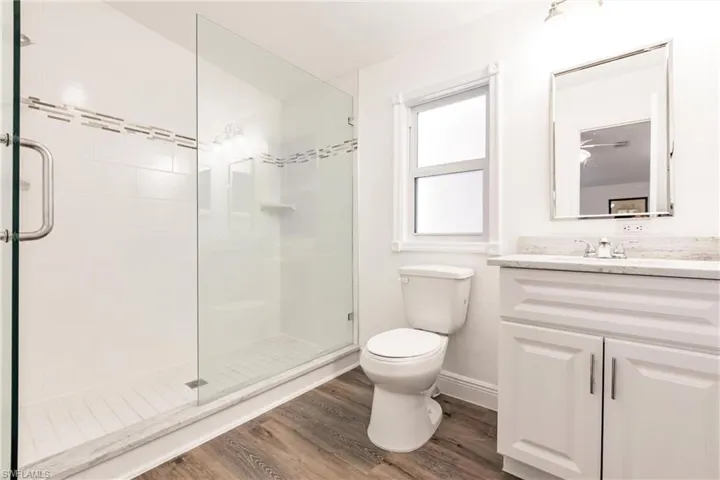 Updated bath with spacious shower and laminate flooring plus large closet