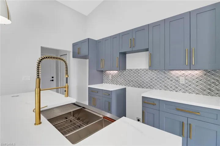 Kitchen with sink and backsplash