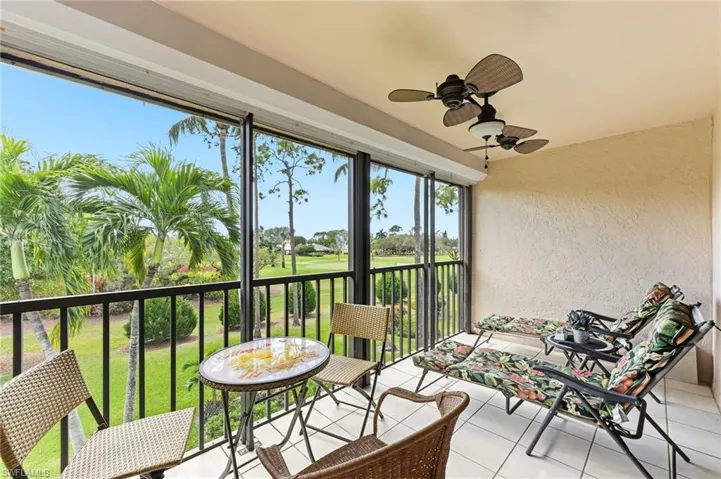 Light-filled lanai with ceiling fan. Beautiful views of the golf course and lake. Perfect for enjoying morning coffee or evening sunsets