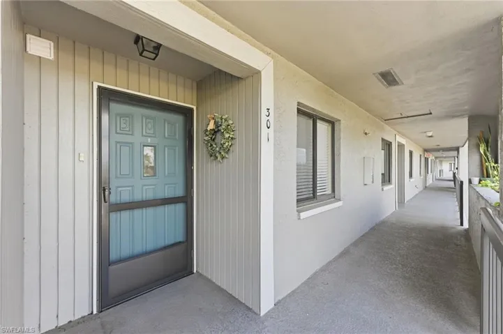 View of exterior entry with elevator on the right