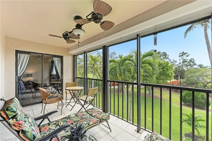 Screened lanai with tile flooring showcasing beautiful landscaping from third-floor.