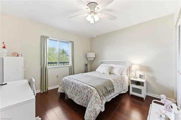 Bedroom featuring hardwood flooring and a ceiling fan