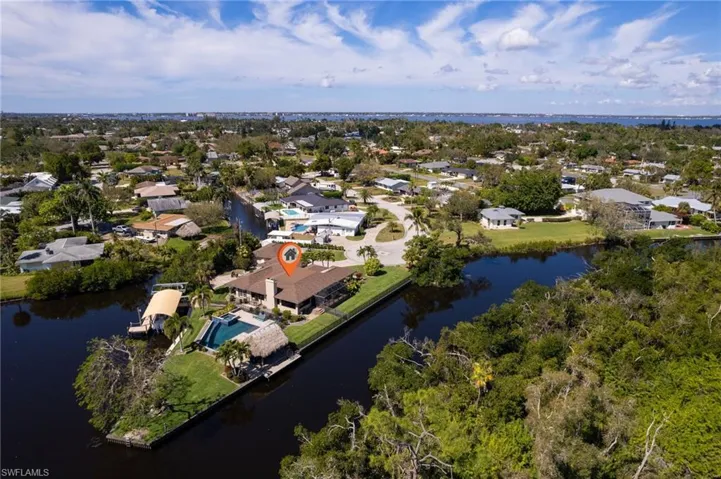 Aerial view featuring a residential view and a water view