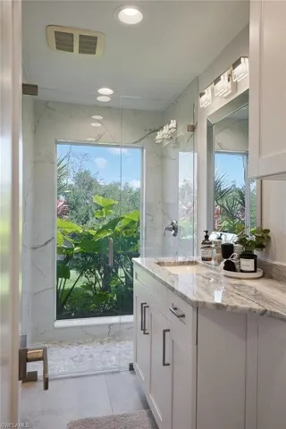 Bathroom featuring recessed lighting, and vanity