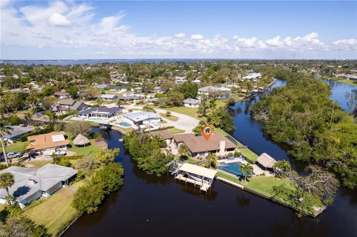 Aerial view featuring a water view and a residential view