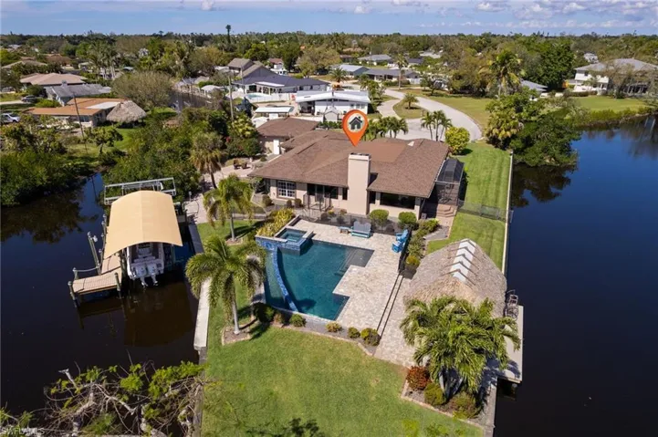 Drone / aerial view with a water view and a residential view