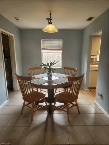 Dining area featuring baseboards and light tile patterned floors