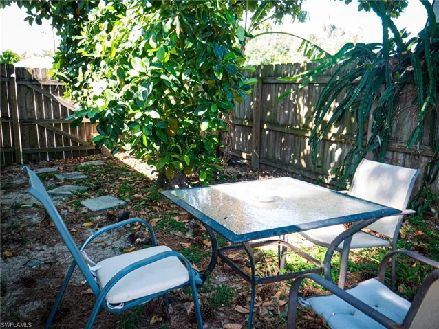 Fenced backyard featuring a patio area and outdoor dining space