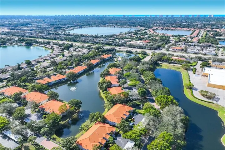 Aerial overview of property's location featuring nearby urban area and a large body of water