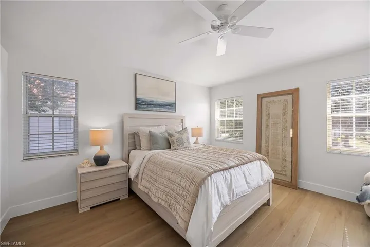 Bedroom featuring light wood-style flooring and ceiling fan
