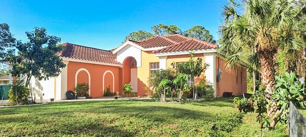 Mediterranean / spanish house featuring a front yard