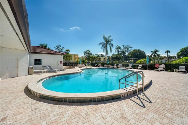 Community pool with a patio area
