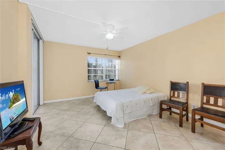 Bedroom featuring ceiling fan and light tile patterned floors