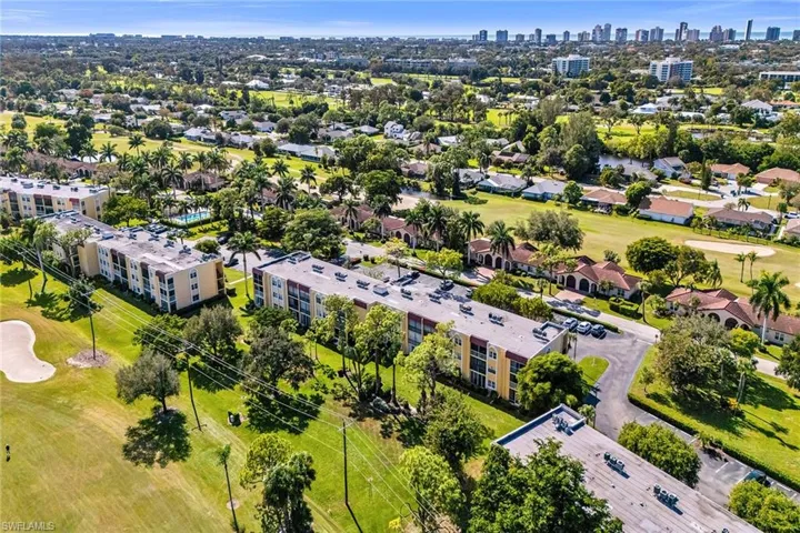 Bird's eye view of a local golf course and city skyline